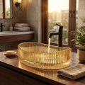 Oval amber glass vessel sink above-counter basin with ribbed exterior, top view