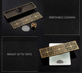 InArt brass linear shower floor drain showing removable insert for odor trap and pest blocking
