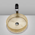 Angled view of faceted diamond-pattern amber glass vessel sink for vanity countertop installation
