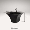 Side angle of glossy black ceramic rectangular wall-mounted sink with flared sides and integrated shroud