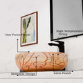 Angled view of decorative ceramic round vessel sink, peach beige floral line-art design for vessel sink on vanity