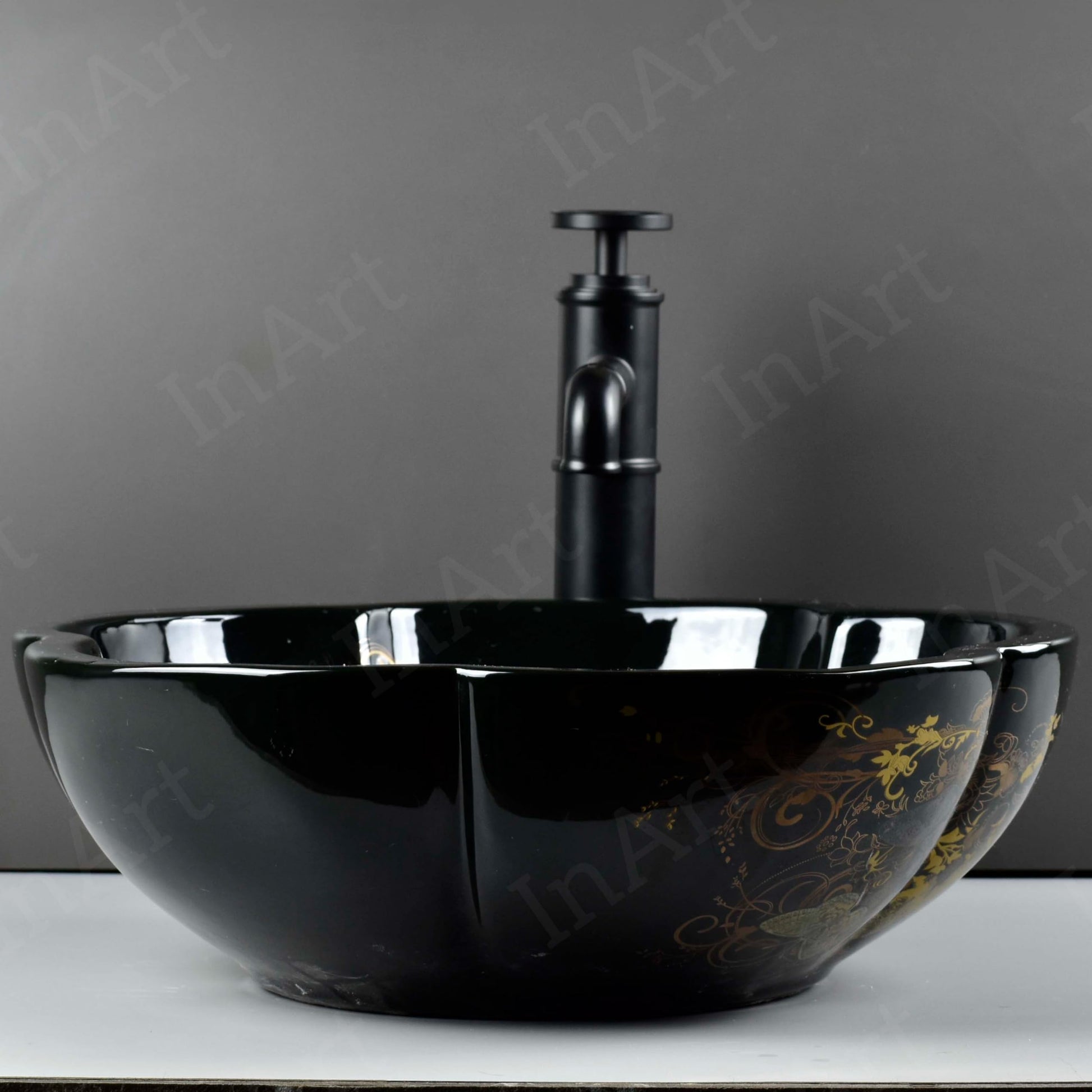 Round ceramic vessel sink on vanity top, glossy black finish with multicolor butterfly-floral design, no faucet holes