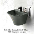 Modern wall mount bathroom sink in glossy gray ceramic with gold stripe detail, close-up of rim and glaze