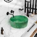 Round green tempered glass vessel sink with textured faceted exterior, above-counter bathroom basin