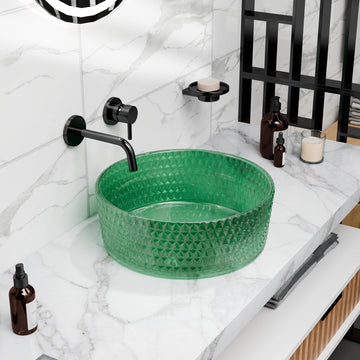 Round green tempered glass vessel sink with textured faceted exterior, above-counter bathroom basin