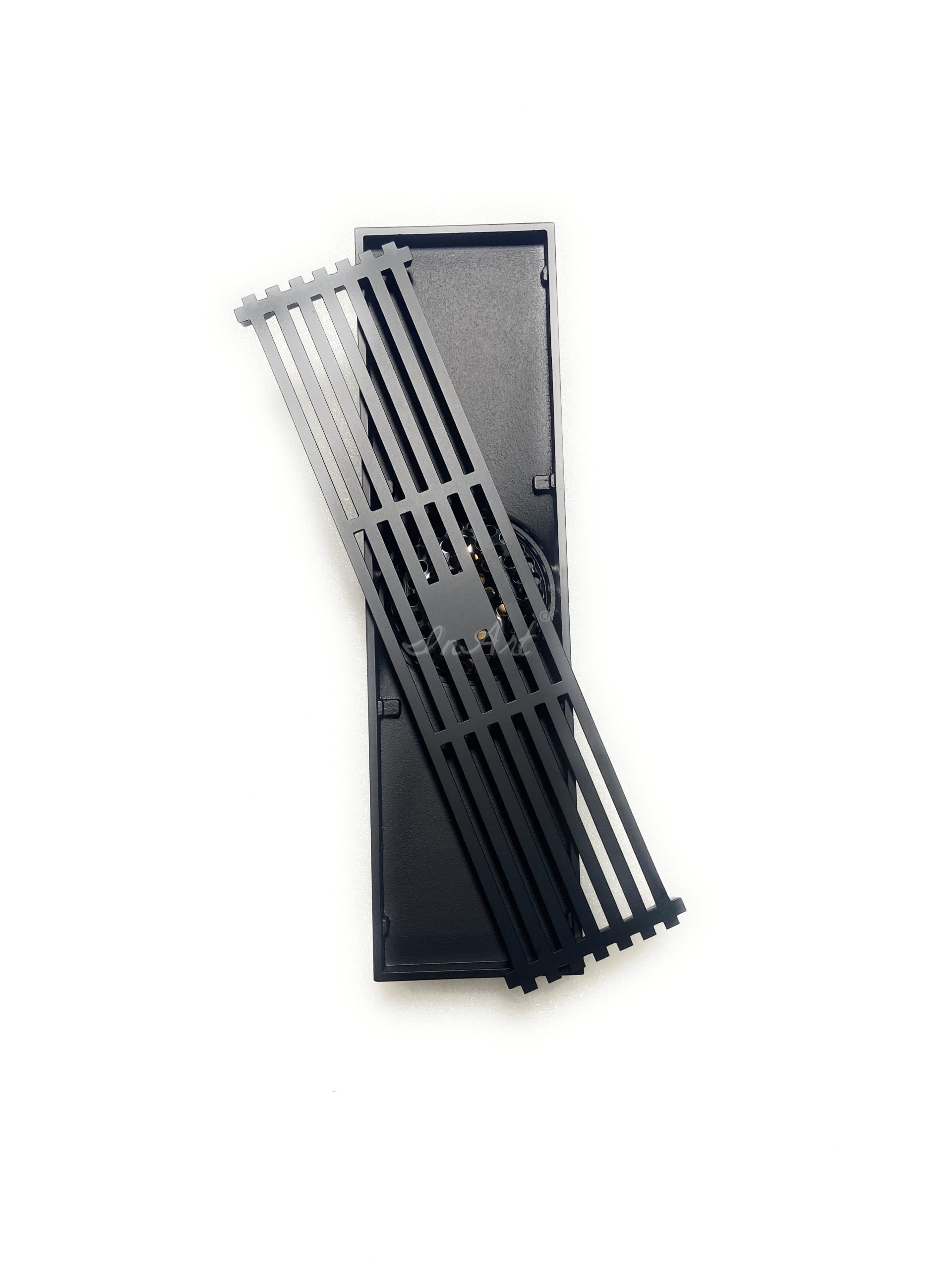 Close-up of removable slotted grate and internal strainer insert on matte black brass floor drain