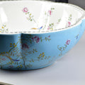 Decorative ceramic vessel sink round shape, high-gloss glaze finish with floral pattern detail