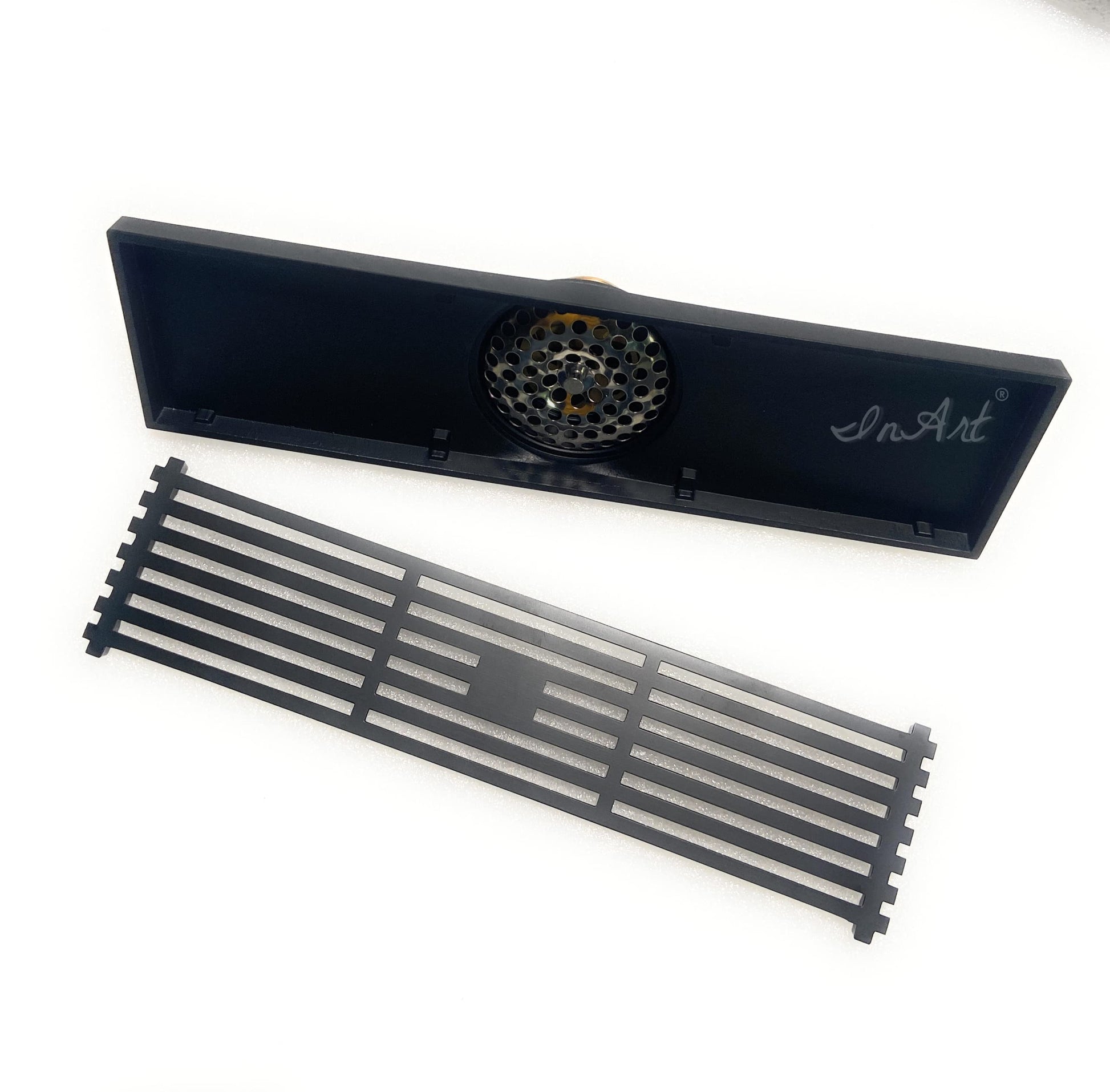 Installed look: matte black brass linear shower floor drain set flush with tile in shower floor