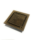 Antique brass square shower drain grate removed showing odor-trap insert, brass floor drain