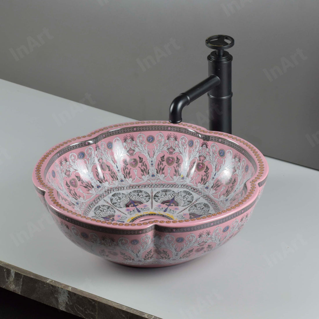 Glazed ceramic round vessel sink with scalloped rim, glossy pink ornate pattern, above-counter basin