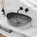 Oval tempered glass vessel sink in smoked black/gray with ribbed textured exterior, above-counter bathroom basin