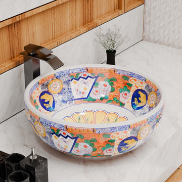Round ceramic vessel sink with glossy white base and multicolor Mexican/Moroccan pattern, above-counter bathroom bowl