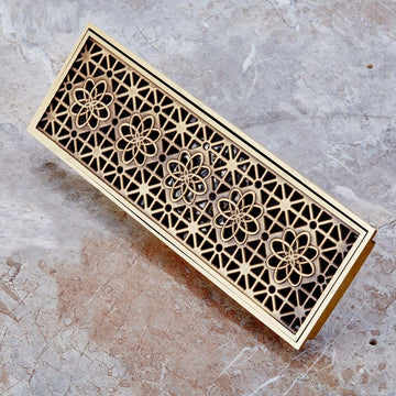 Antique brass brass linear shower drain strainer with decorative lattice grate, 12 x 4 in