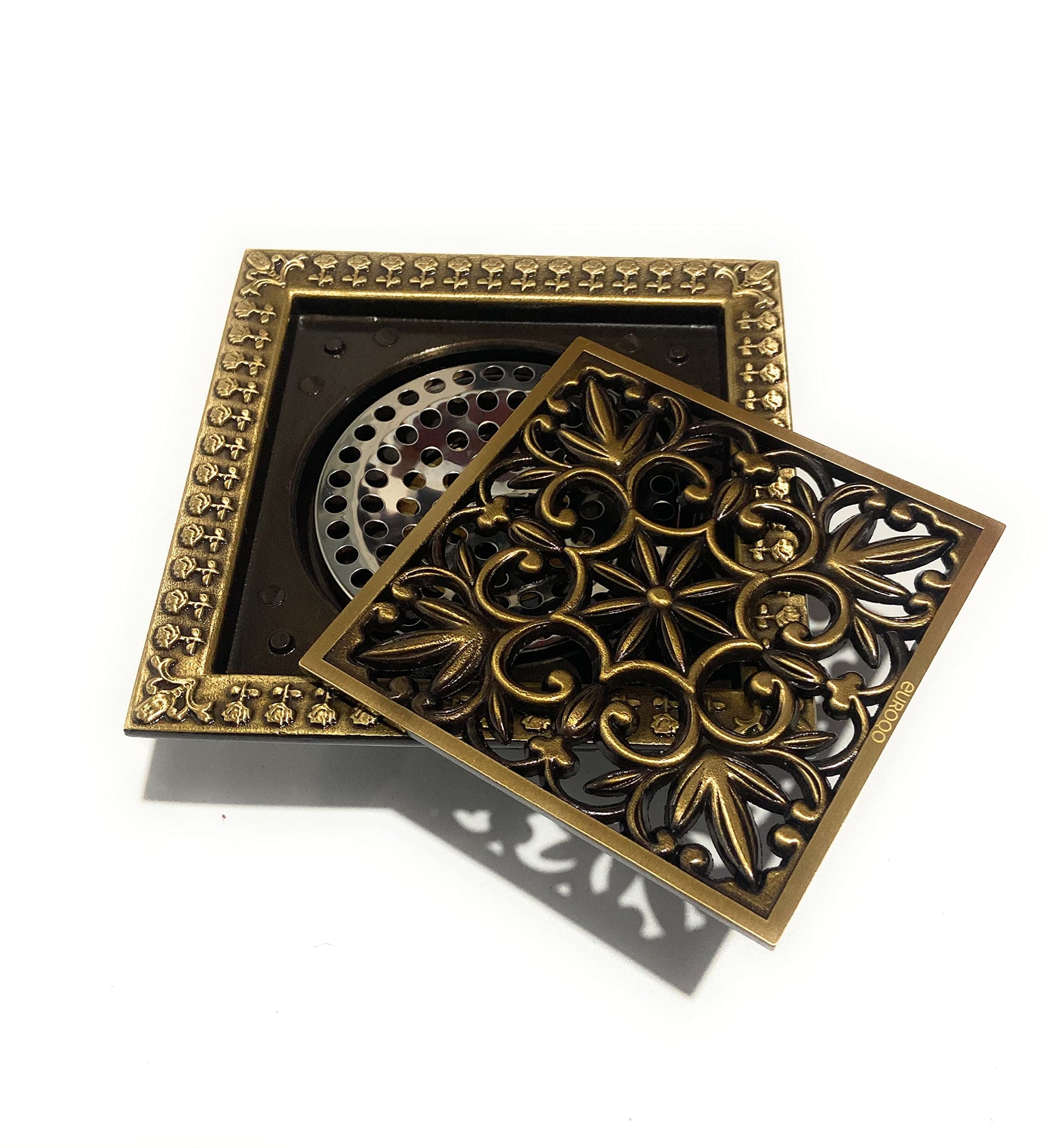 Shower grate drain assembly in brass showing odor trap and pest-blocking insert, 4 inch outlet