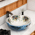 Round glazed ceramic vessel sink bowl with blue floral exterior and white patterned interior, above-counter bathroom basin