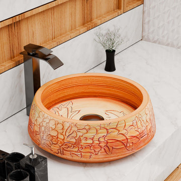 Round ceramic vessel sink with glossy wood-grain finish and floral artwork, above-counter bathroom basin